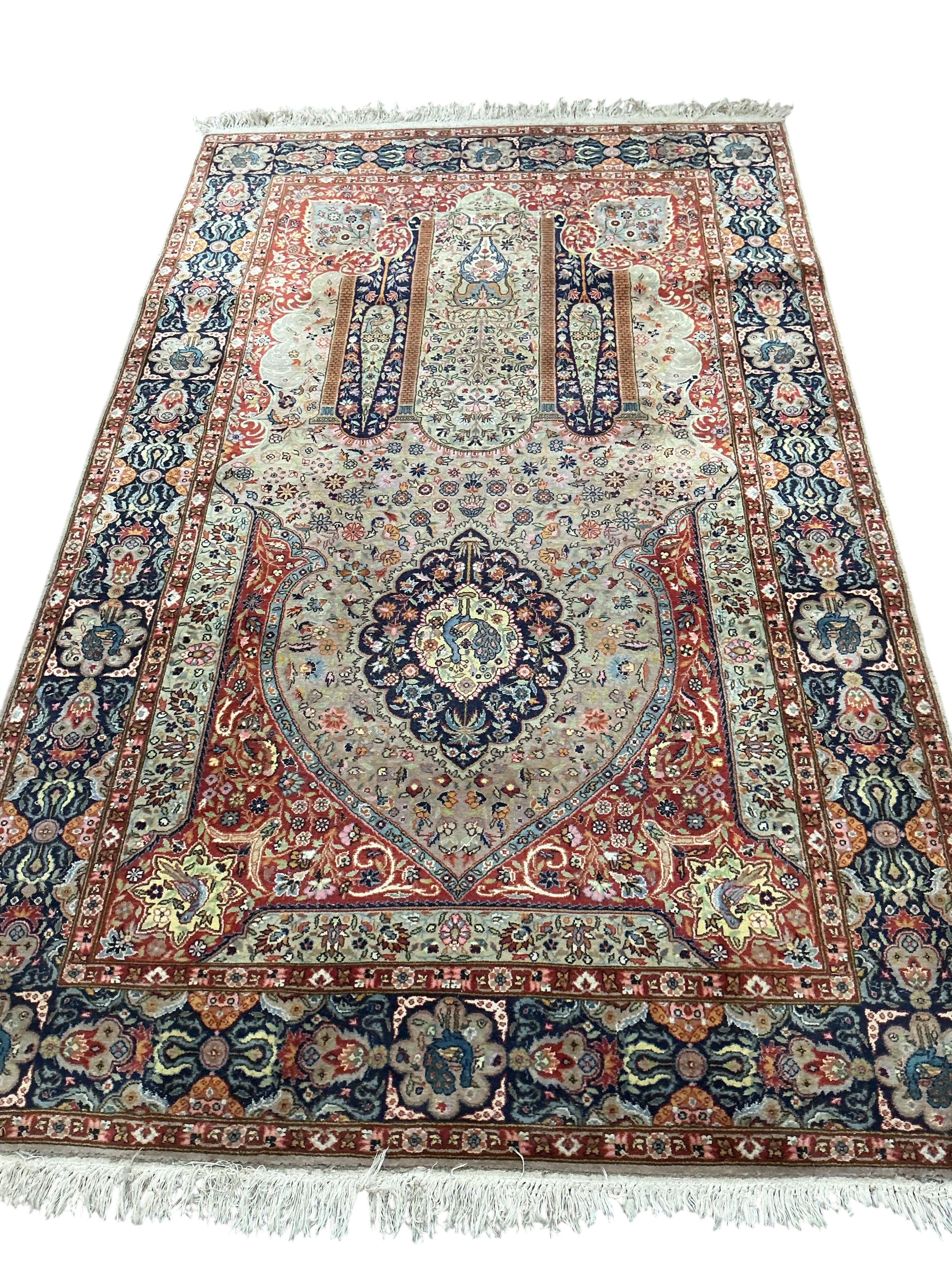 A Kerman prayer rug, the floral field with a Mihrab, 230 x 139cm